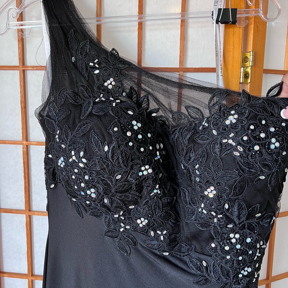Black Gown with Beading. Off Shoulder on 1 side. split back has a small train.